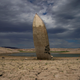 A formerly submerged boat sticks straight out of newly exposed ground at Lake Mead.